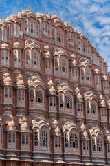 Fototapeta na wymiar Hawa Mahal, pink palace of winds in old city Jaipur, Rajasthan, India. Background of indian architecture