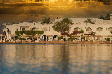Fototapeta premium Calm beach on the red sea of Sharm El Sheikh during sunrise, Egypt