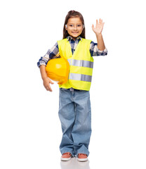 building, construction and profession concept - smiling little girl with protective helmet in safety vest and goggles waving hand over white background