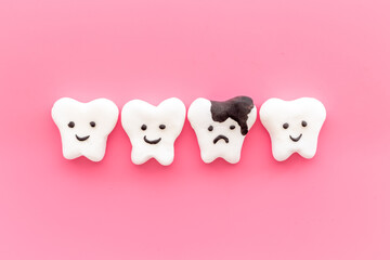 Dental health concept. Teeth models with caries or plaque