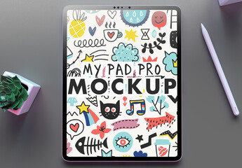 My Pad Pro Tablet Mockup on a Clean Grey Desk and a Succulent Flower on Over the Head View