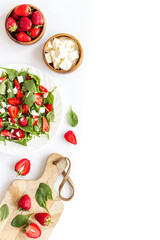 Vegan meal - spinach salad with strawberry and goat cheese