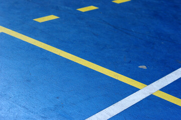 Fototapeta na wymiar parking lot with blue and white stripes