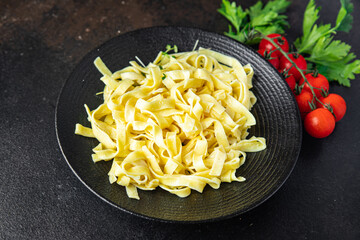 pasta cheese fettuccine or tagliatelle macaroni meal Italian cuisine snack copy space food background rustic