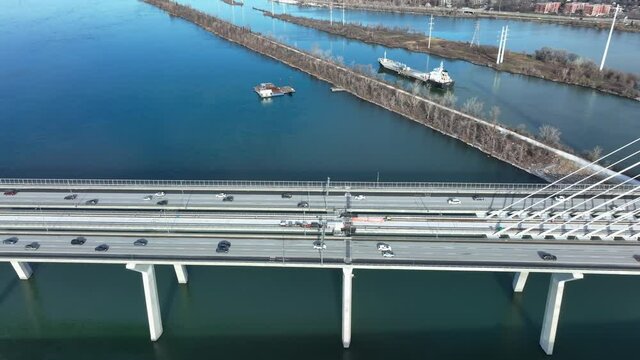 Cinematic view from above of vehicle passing on the new Champlain Bridge in Montreal City, Canada