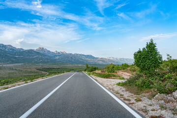 Scenic road. The road is surrounded by a magnificent natural landscape.