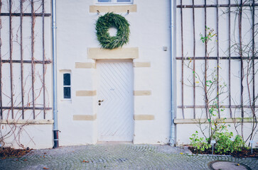 Door of house with Christmas wreath