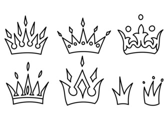 Set of hand drawn vector crowns in doodle style on white background.