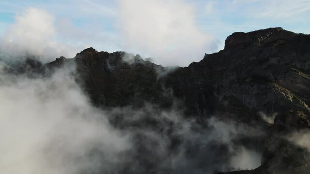 Aerial footage over the highest mountains on Madeira island. Pico do Arieiro and Pico Ruivo are very popular peaks to visit. Hikers paradise known as PR 1 trail Vereda do Areeiro. 4k footage