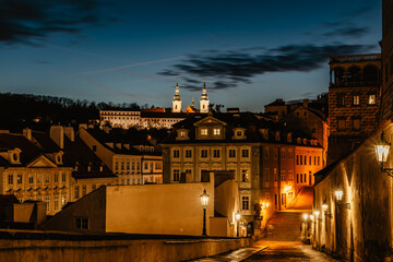 Obraz na płótnie Canvas View of Strahov Monastery with church of Assumption of the Blessed Virgin Mary after sunset,Prague evening panorama,Czech Republic.Romantic calm atmosphere.Beautiful sightseeing,travel scenery