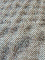 Beige cotton fabric texture background. Natural boho textile canvas.