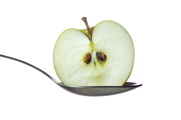 Half of green apple in spoon isolated
