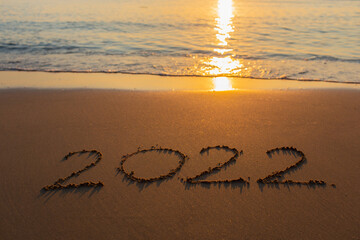 2022 on the beach happy new year on nature background	