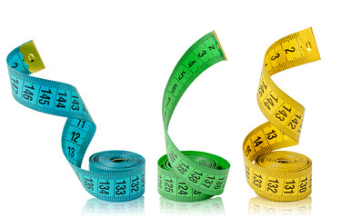Three multi colored measuring tapes isolated on white background.