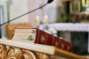The church book with many bookmarks is a stand for speeches and speeches.