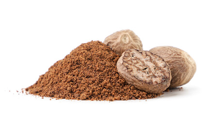 Whole and crushed nutmeg on a white background. Isolated