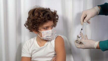 Europe, Italy, Milan - Vaccination against Covid-19 Coronavirus for children in pediatric age 5 to...