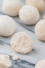 Kurut (kurt)  cheese -  traditional Asian cheese made from sheep's, goat's or cow's milk. Kazakh and Kyrgyz national food. white salty balls from dry cheese close-up on marble background