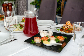 Rolls with salmon and caviar on a black plate. Food concept, snack. with seafood.