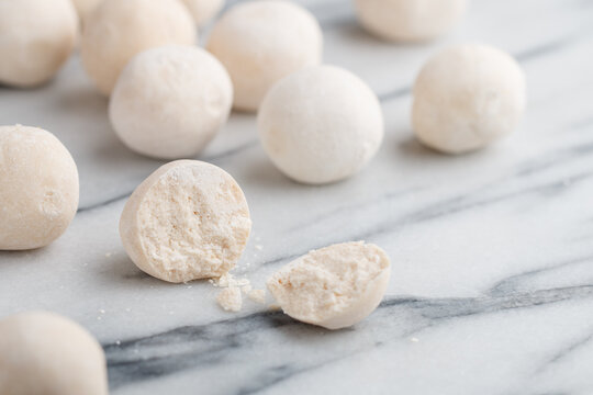 Kurut (kurt)  cheese -  traditional Asian cheese made from sheep's, goat's or cow's milk. Kazakh and Kyrgyz national food. white salty balls from dry cheese close-up on marble background