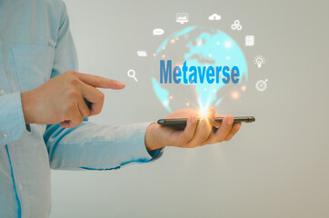 Man hand hold smartphone virtual world icon. Communication and use of modern Internet technology metaverse , Social Networking, online marketing, digital online. Concept technology.