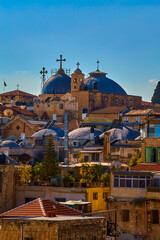 Fototapeta premium Panoramic view of Church of Holy Sepulcher from roof Austrian Hospice of Holy Family, refuge for itinerant pilgrims, was opened in 1854 by Catholic Church of Austria in Holy Land. Jerusalem, Israel