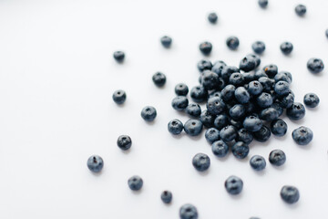 A bunch of ripe, beautiful blueberries, blueberries close-up on a white background. Healthy food, and vitamins.