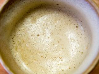 Top view of a cardboard cup of coffee.