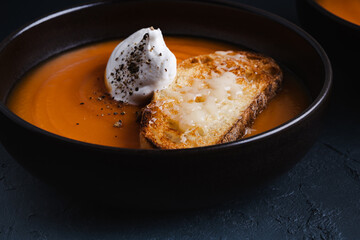 Creamy butternut soup with creamand parmesan toasts