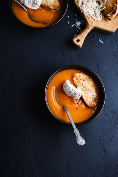 Creamy butternut soup with cream and parmesan toasts