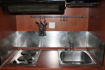 Cheap tiny fitted chipboard kitchen: sink, electronic stove, range hood, cutlery dryer, hooks for...