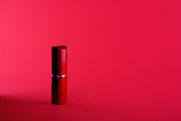 Red lipstick with a gold border on a red background