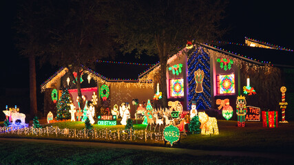 Christmas lights. House decorated on Christmas. Snowman, Santa Claus Reindeer sleigh, Polar bear....
