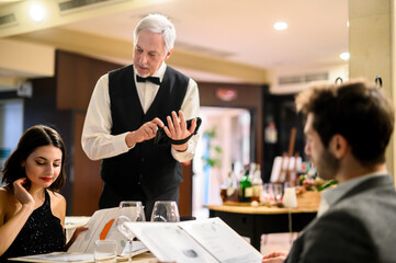 Waiter taking orders in a restaurant