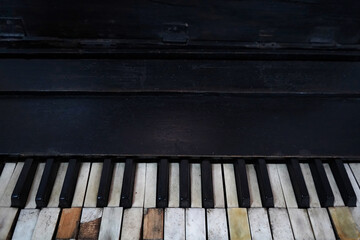 Old piano with damaged keys