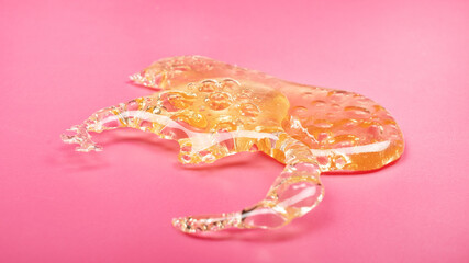 golden transparent cannabis shatter, cannabis wax concentrate