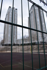 buildings behind the fence