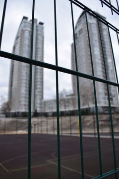 buildings behind the fence