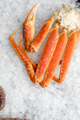 fresh red king crab legs on crushed ice.