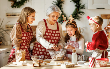 Happy family with children cooking together on Christmas day in cozy home kitchen