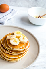 cooked pancake on plate at wooden background