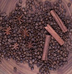 cinnamon sticks and coffee beans on an old wooden table