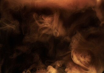 Orange smoke on black ink background, colorful fog, abstract swirling ocean sea, acrylic paint pigment underwater.