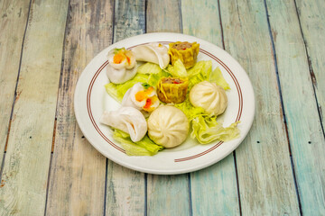 Chinese dim sum is a filled dough that is often served with tea. It is eaten sometime between the morning and the early afternoon