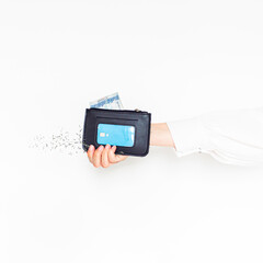 Young woman's hand holding a wallet on white background. Aesthetic concept.