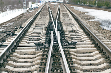 Fototapeta premium Railway station, high speed switch shunter on tracks. Direction control mechanism, route changer, transportation system
