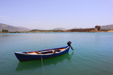 Fototapeta na wymiar Butrint Lake with a boat in Butrint National Park, Buthrotum, Albania