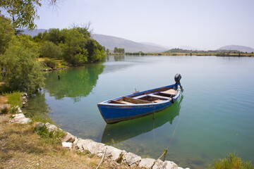 Butrint Lake with a boat in Butrint National Park, Buthrotum, Albania