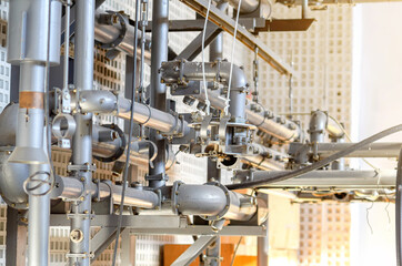 Bolted connection of pipes. Wires. Devices. Industrial background.