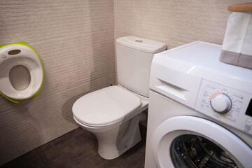 The furniture of the home toilet, toilet and washing machine, a seat for the little ones.
